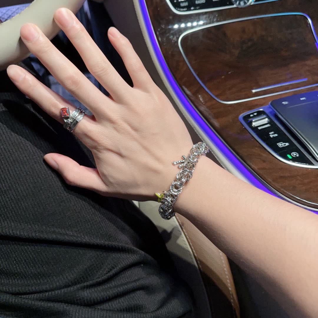 Louis Vuitton Silver Bracelet with Yellow Flower Charm